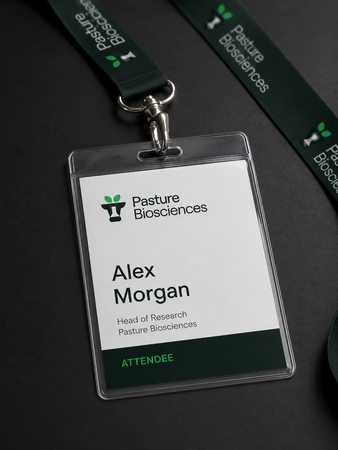 Pasture Biosciences conference lanyard and badge.